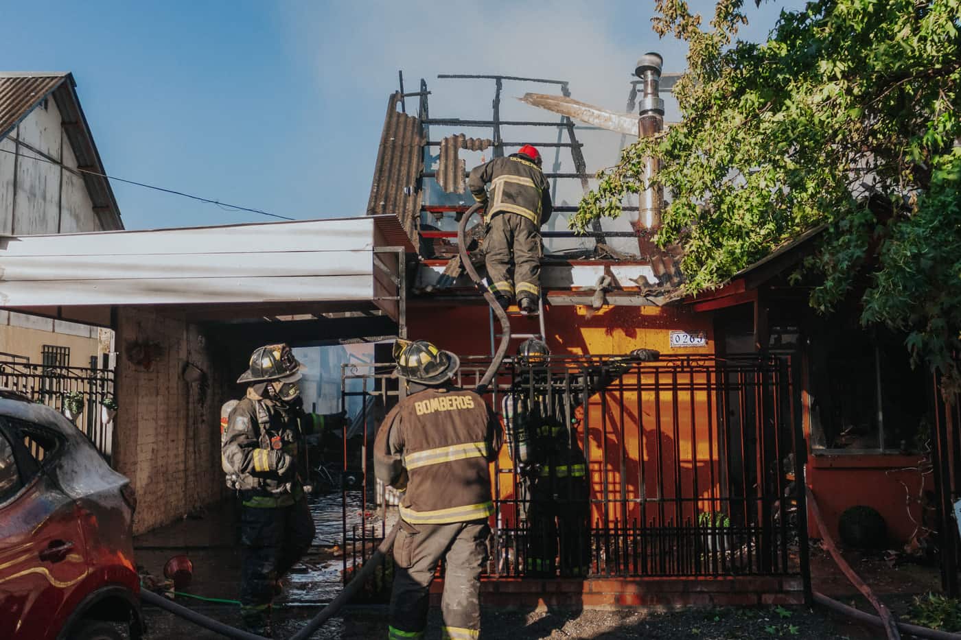 Firefighters working to put out a house fire