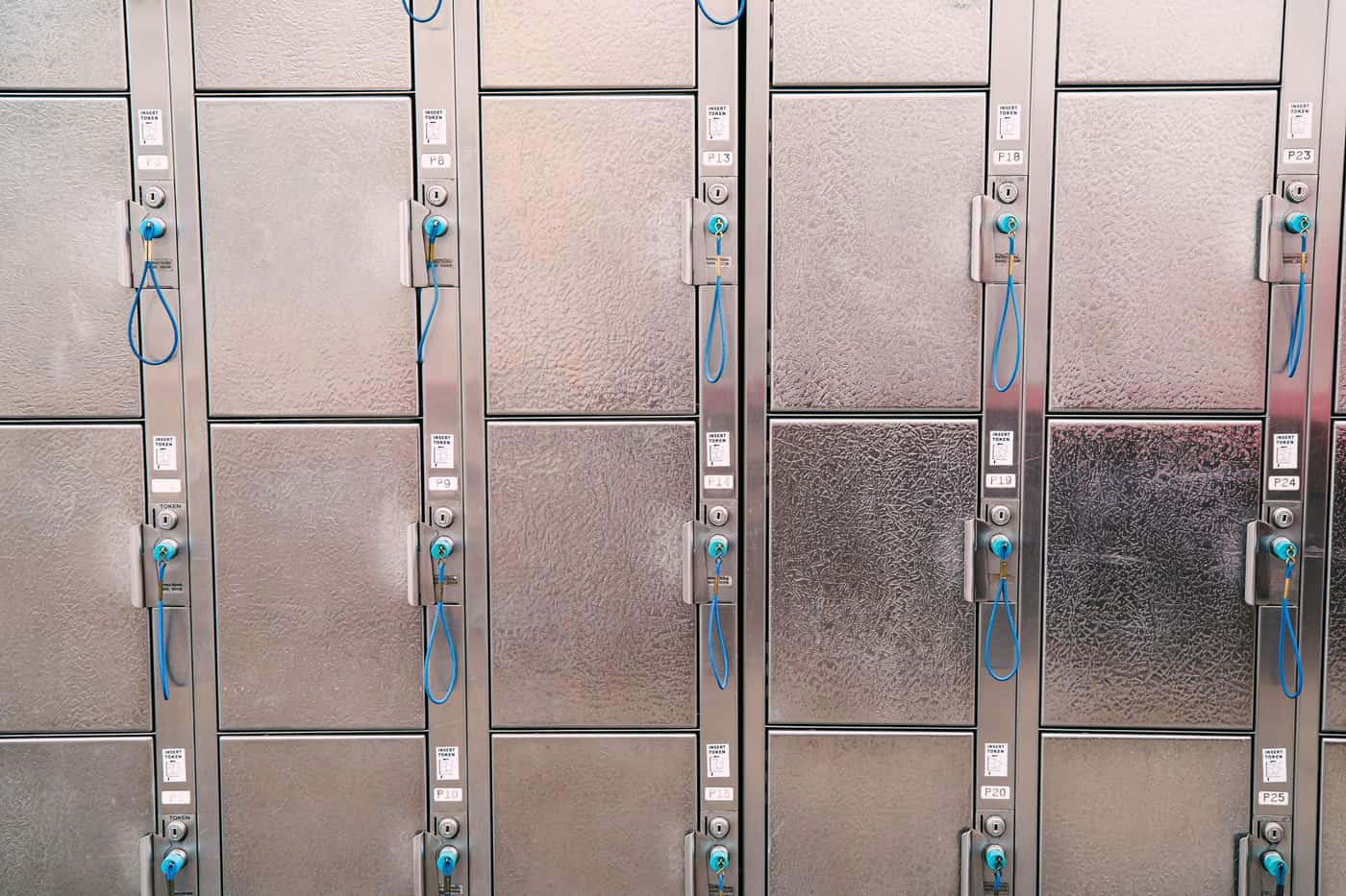 Metal lockers secured with blue security cables